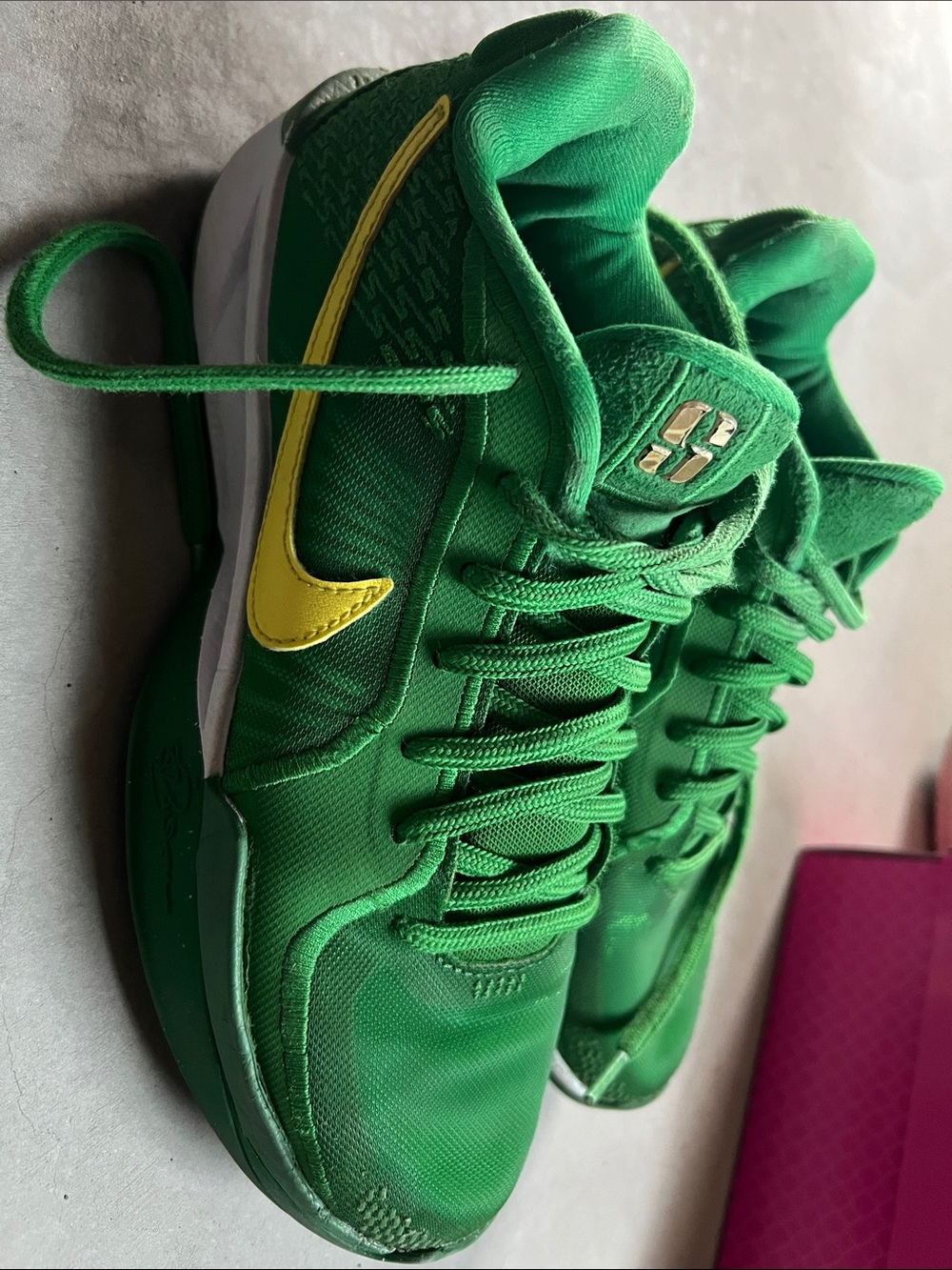 Nike Green Low-Top Sneakers with Yellow Swoosh
